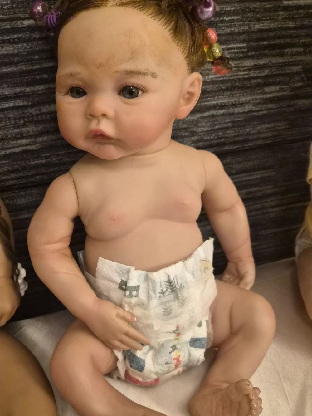 Reborn Baby Doll with Brown Hair and Pink Hair Beads